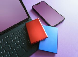 Raspberry Pi Raid Colorful gadgets including a smartphone, tablet, and SSD on a purple background, ideal for tech-themed projects.